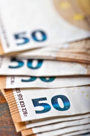 Pile of fifty euro banknotes. Currency notes stacked. Money bank finance business concept. Selective...