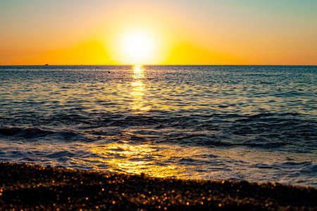 Red sunset over the sea. Beautiful sunset. Tyrrhenian Sea sunset in Calabria, Italy.の写真素材