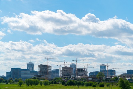 Global construction of a new district in the city. Erection of buildings.の写真素材