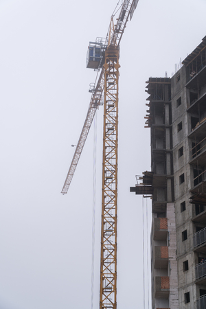 Construction of houses in winter. Severe weather.の写真素材