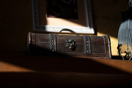 An old chest on a shelf in an ancient houseの写真素材
