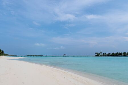 Wide sandy beach on a tropical island in Maldives. Indian oceanの写真素材