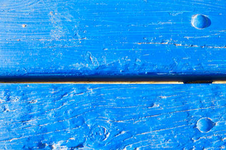 Wooden planks with screws painted blueの写真素材
