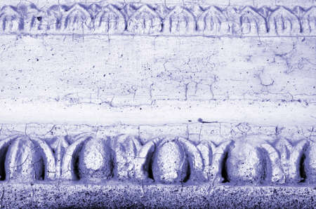 Fragment of ornament on building in classical style coloured very peri. Background with copy spaceの写真素材