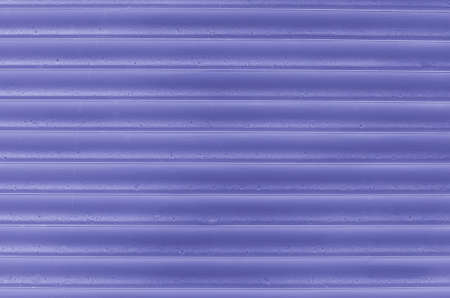 An outdoor jalousie window close up background colored very peri