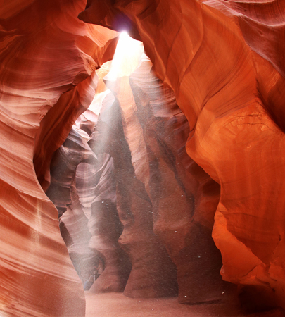 Upper Antelope Slot Canyon Showing the Light Beam Into the Canyon, Page, Arizona, USA. Navajo land. Amazing nature background good for wallpaper. Rays of light illuminating red sandstone cave.の写真素材