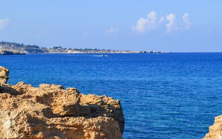 Protaras, the island of Cyprus. Mediterranean coastline. Beautiful day, blue sky, foamy waves of the...