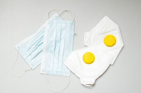 Close up. Hygiene products during Coronavirus Pandemic COVID-19. Medical masks and respirators with...