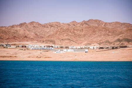 The coastline of the Red Sea and the mountains in the background. Egypt, the Sinai Peninsula, Dahab.