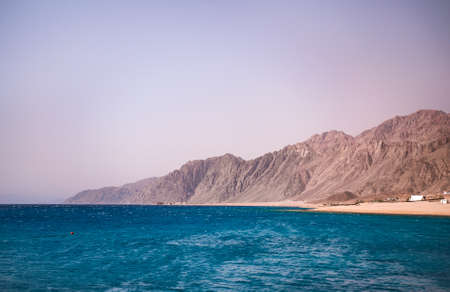 Summer holidays. The coastline of the Red Sea and the mountains in the background. Egypt, the Sinai Peninsula, Dahab.の写真素材