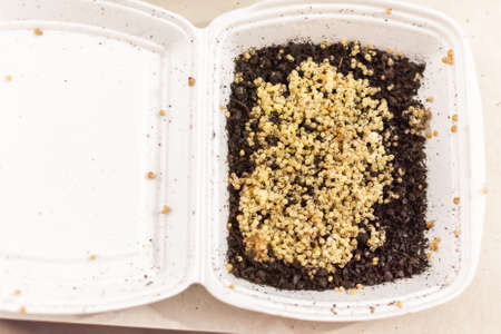Top view. Close up, macro. Lots of small snail caviar with soil in a white bowl.の写真素材