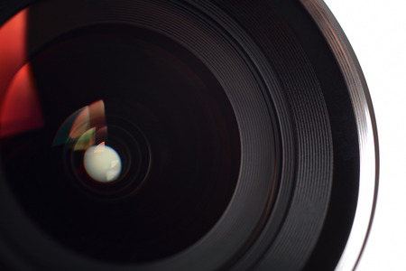Camera lens close-up on white backgroundの写真素材