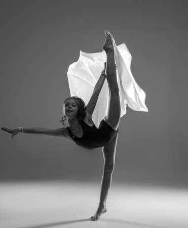 rythmic gymnastic girl stretching in studio, ballet dancerの写真素材