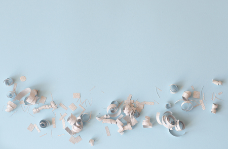 Silver confetti on a blue background.の写真素材