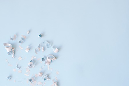 Silver confetti on a blue background.の写真素材