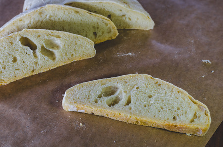 Homemade farmer's wheat bread on craft paper, closeup