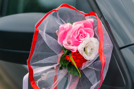 Wedding car decoration, rear-view mirror and artificial flowers.の写真素材