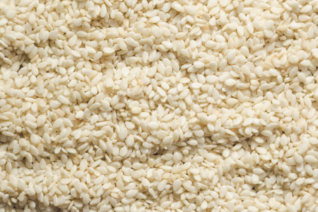 White peeled sesame seeds close up, background, textureの写真素材