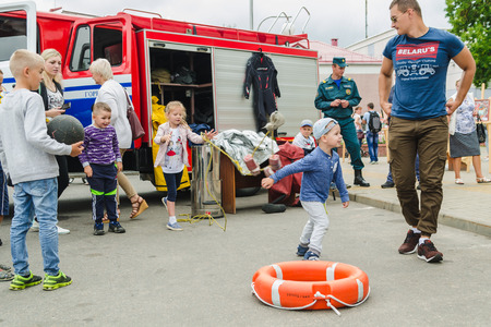 HORKI, BELARUS - JULY 25, 2018:Children of different ages play on a holiday in the park on a summer day in a crowd of people.のeditorial素材
