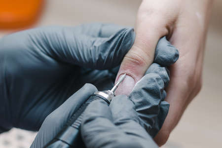Hardware manicure process in a nail service salon close-upの写真素材