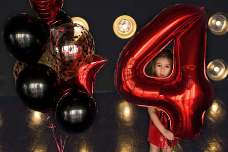 Girl dressed in rock style. Birthday baloons for party and celebrations. ballons abstract decoration. rock girl celebrating birthday.の写真素材