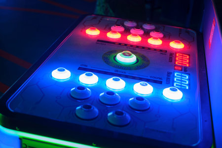 A table top slot machine with glowing buttons. A game based on reaction speed
