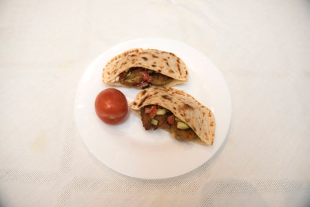 popular Israeli dish - falafel in a plate on a white tablecloth