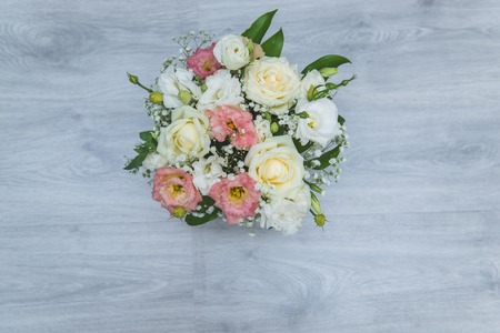 Garden flowers over grey wooden table background. Backdrop with copy space