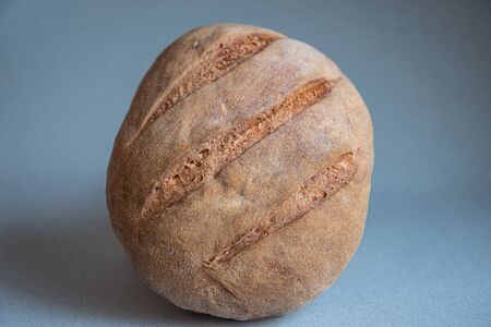 freshly baked bread isolated on blue background