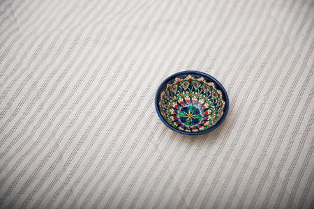 RUSSIA. MOSCOW. March 2020. Uzbek cup on a soft plaid light backgroundのeditorial素材