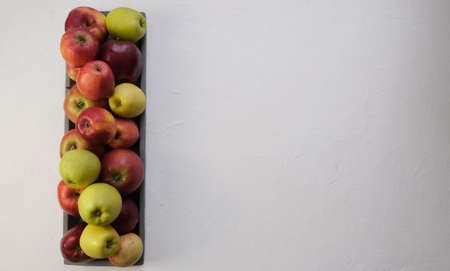 Green and red apples close up. Juicy fruits. Useful snack. Vegetarian food. Delicious, healthy...
