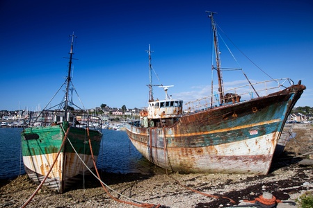 old boat in french harbourの写真素材