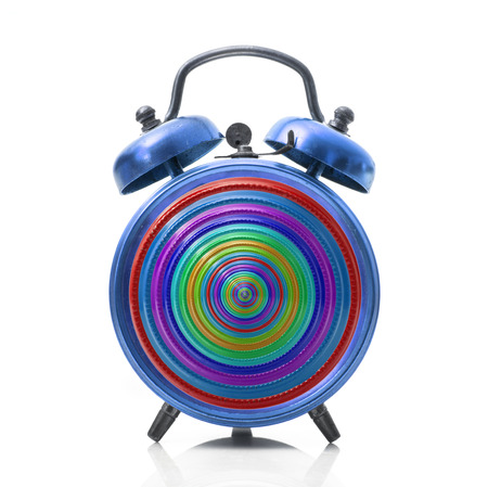 a strange rainbow alarm clock on white background