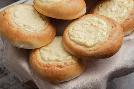 Buns with cottage cheese. Ring of dough with quark in the middle. baking at home.の写真素材