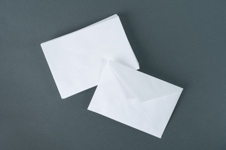 Blank envelopes on gray background. Back and front view. Template for design presentations and...