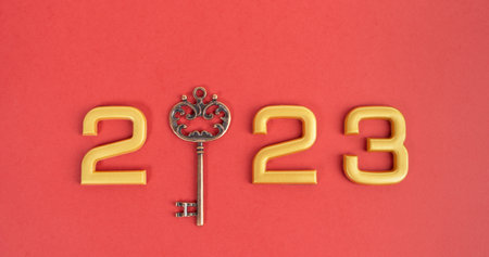 Number 2023 with key on red background. Happy New Year and Christmas 2023 concept.の写真素材