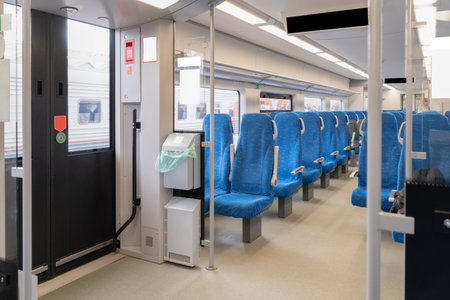 Inside The Wagon Train. Interior of the passenger train with empty blue fabric seats. High quality...