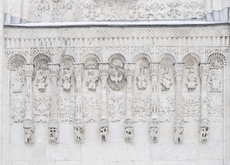 White stone carving of Cathedral of St. Demetrius in Vladimir. Fragment of a carved facade. Cathedral of Saint Demetrius in Vladimir.の写真素材