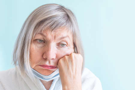 Happy natural woman seniora with a cotton pad cleanses the skin. Anti age concept. Copyspase. Bannerの写真素材