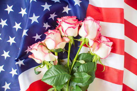 4th of July Independence Day USA. American flag and flowers for Memorial day. Memorial Day concept. Federal holiday in the United States.の写真素材