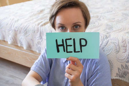 Women with text Help. Women violence and abused concept. Woman alone depression stress. Stop...
