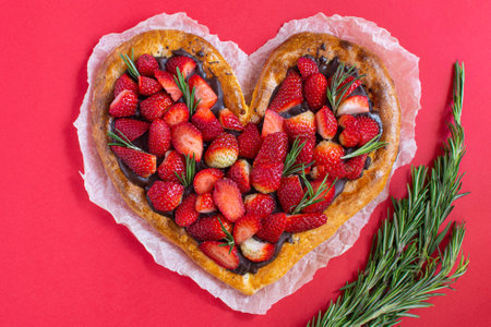 Pizza Valentines Day, sweet dessert with chocolate and strawberries, with caramel sauce and chocolate. Modern minimal love concept Valentine Day on a red background.の写真素材