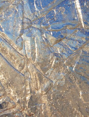 background with a pattern on ice with blue and orange colorsの写真素材