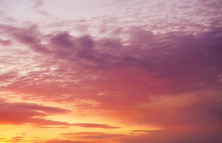 heavenly dawn, pink and purple beautiful cloudsの写真素材