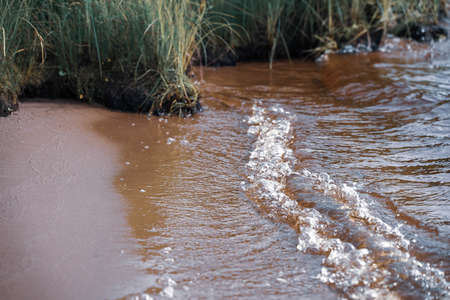 water flowing into the riverの写真素材
