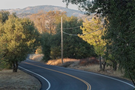 Two lane, winding paved country road in southern califoniaの写真素材