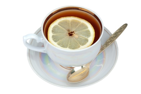 Cup of tea and sauser with lemon and spoon の写真素材
