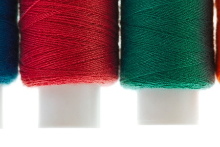 bobbin of thread isolated on white backgroundの写真素材