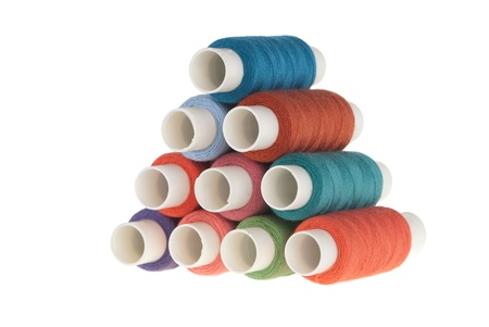 heap bobbins of thread isolated on white background