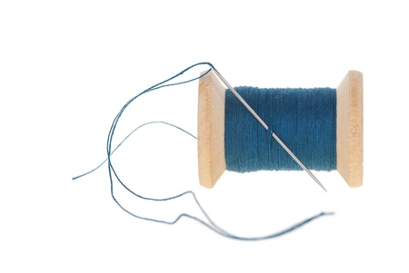 bobbin with needle isolated on white backgroundの写真素材